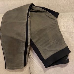 Theory leggings in black with brushed cotton olive green front.